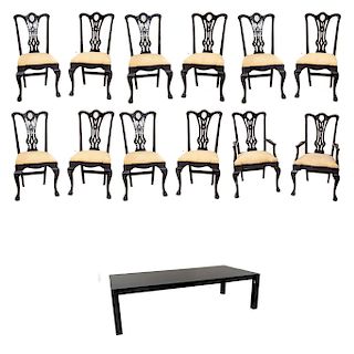 Juego de sillas y mesa.S. XX.Elaborado en madera tallada y enchapada. Sillas estilo Chippendale y mesa rectangular. Piezas: 13