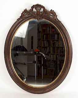 CARVED AND MOLDED OVAL WALL MIRROR