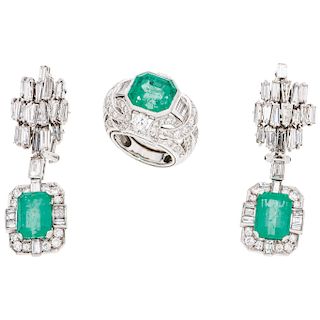 An emerald and diamond 18K white gold ring and pair of earrings.