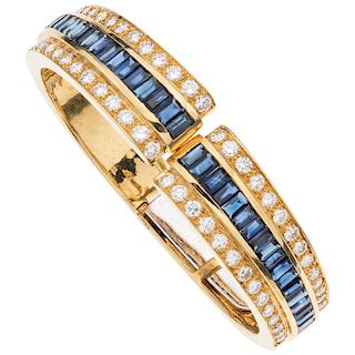 A sapphire and diamond 18K yellow gold cuff bracelet.