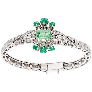 An emerald and diamond palladium silver bracelet.