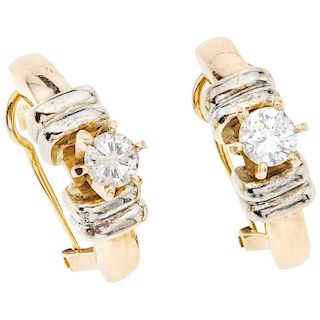 A diamond 14K yellow and white gold pair of earrings.