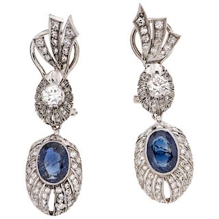 A sapphire and diamond palladium silver pair of earrings.