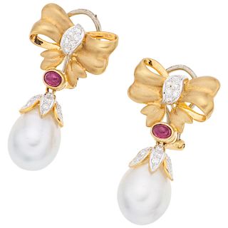 A cultured pearl, ruby and diamond 18K yellow gold pair of earrings.