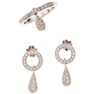 A diamond 18K white gold ring and pair of earrings set.