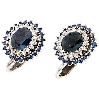 A sapphire and diamond 14K white gold pair of earrings.
