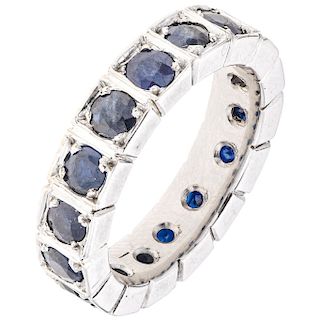 A sapphire 14K white gold eternity ring.