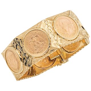 An 18K yellow gold bracelet with 21.6K yellow gold coins.