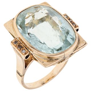An aquamarine and diamond 14K yellow gold ring.