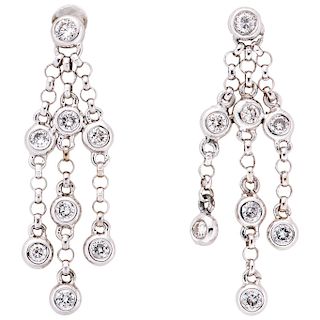 A diamond 18K white gold pair of earrings.