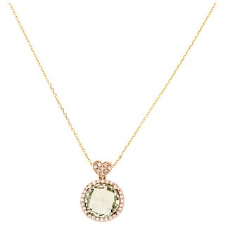 An olivine and diamond 18K rose gold pendant and 14K yellow gold necklace.