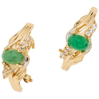 A nephrite jade and simulants 14K yellow gold pair of stud earrings.