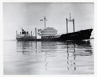 Four black and white tanker ship photographs