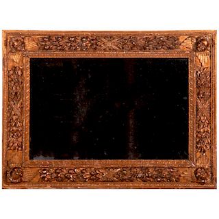 An 18th century carved giltwood mirror.
