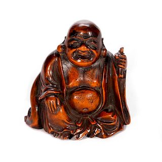 A 19th century Chinese carved figure of Budai.