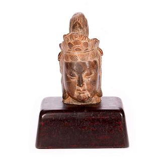 Asian carved stone head.