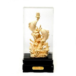 A Chinese simulated ivory carving of fish.