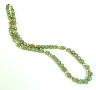 14 Karat Yellow Gold Beaded Jade Carved Necklace.