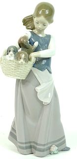 Lladro porcelain figure girl with puppies in baske
