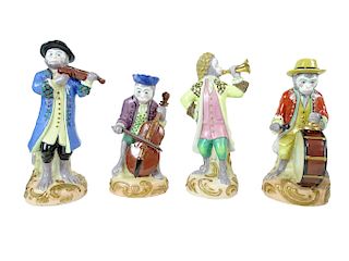 (4) Four Porcelain Musical Monkey Figures