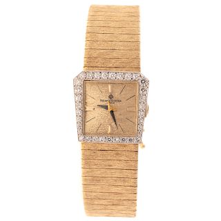 A Diamond Wide Gold Link Watch by Baume & Mercier