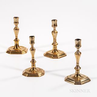 A Pair and Two Single Brass Candlesticks