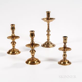 Four 18th Century European Brass Mid-drip Candlesticks