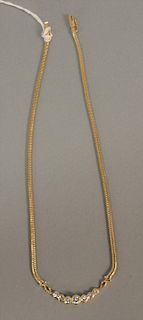 14K gold necklace set with 7 diamonds, largest being approx. .40 cts, 17 gr.