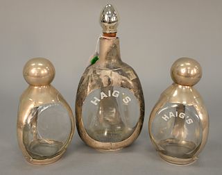 Three piece Haig lot to include three sided bottles with silver holders, hts: 7 in., 7 in., 10 in. Provenance: An Estate from 5th Avenue, New York