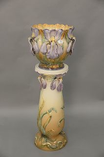 Large majolica jardiniere on stand stand, with molded iris, orchids, shell mark on bottom, similar to Delphin Massier. Ht. 44 1/2 in.