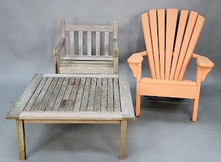 Three piece group to include teak arm chair, teak coffee table, and painted adirondack chair. coffee table ht. 16 in., top: 36 1/2" ...
