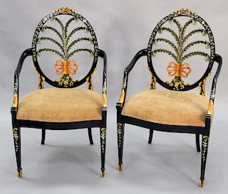 Pair of wheel back paint decorated arm chairs with prince of wales design. ht. 42 in.