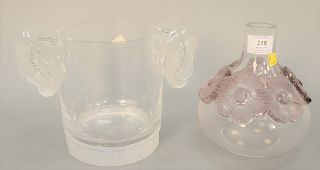Two Lalique pieces to include a flower ice bucket with crystal flower handles (Ht. 7 in.), along with crystal vase with purple handl...