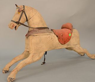 Early painted and carved wood childs rocking horse with leather ears, ht. 20 1/2", lg. 34".