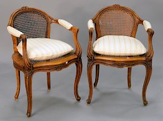 Pair of Louis XV style armchairs with caned back and seat and custom pillows (one hole in caning).