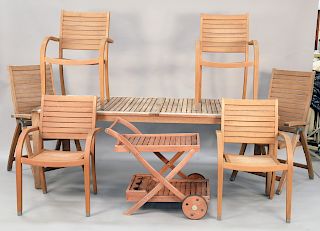 Eight piece teak set to include rectangular table, six arm chairs plus tea cart, (stained), ht. 29 1/2 in., top: 40" x 88".