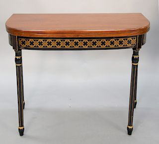 Mahogany D shaped game table with black and gold decoration, ht. 28 1/2 in., wd. 35 in.
