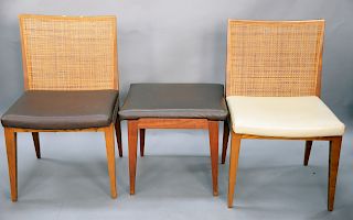 Four Danish pieces to include pair of chairs along with a pair of footstools.