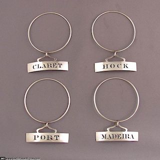 Four George III Sterling Neck-Ring Wine Labels