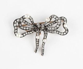 An antique silver-topped diamond bow brooch