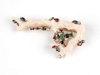 A gold, white coral branch and gem brooch