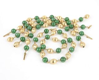 A collection of jade and gold beads