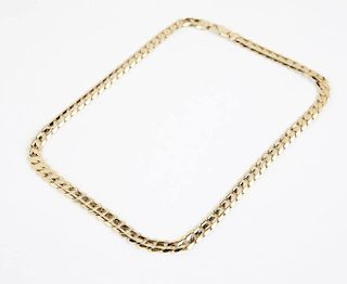 A gold curblink necklace