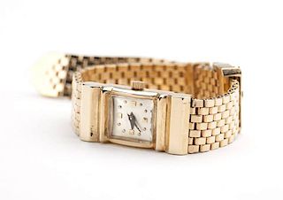A gold buckle and bricklink bracelet wristwatch