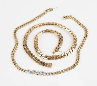 A set of two gold link neck chains