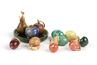 A group of hard stone carved fruit pendants