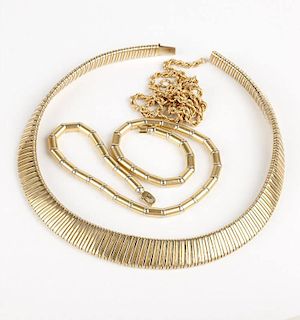 A group of three gold necklaces