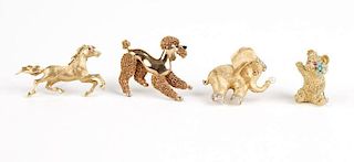 A collection of four gold animal brooches