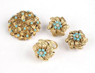 A set of turquoise and gold jewelry