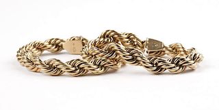 A pair of gold French rope bracelets